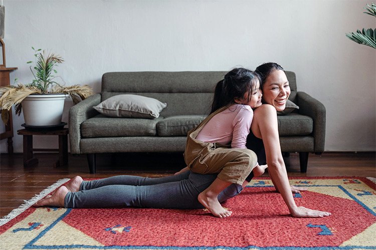 Woman Feeling Great & Doing Yoga With Daughter